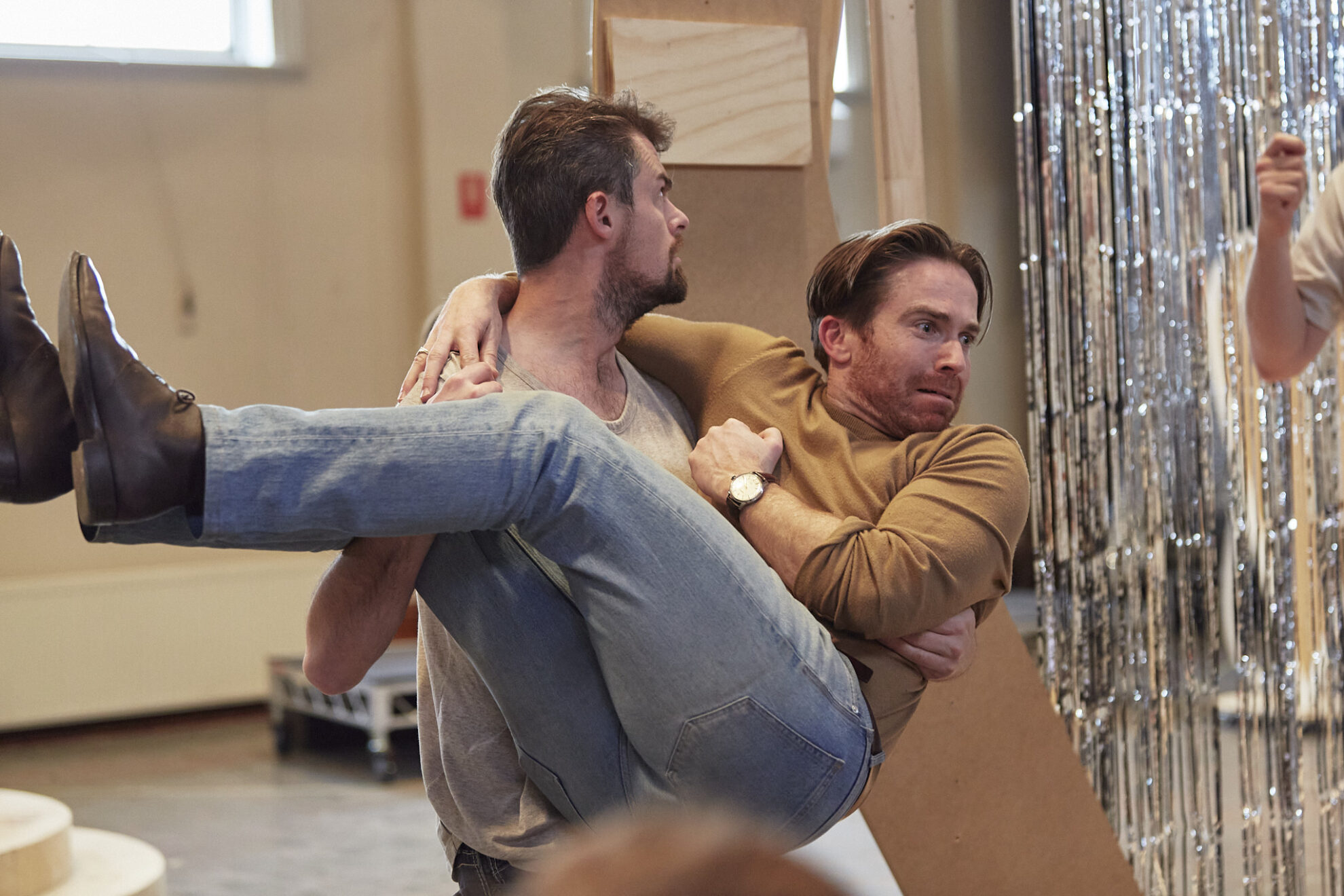 Doug Kelly being lifted by Kyle Stegall